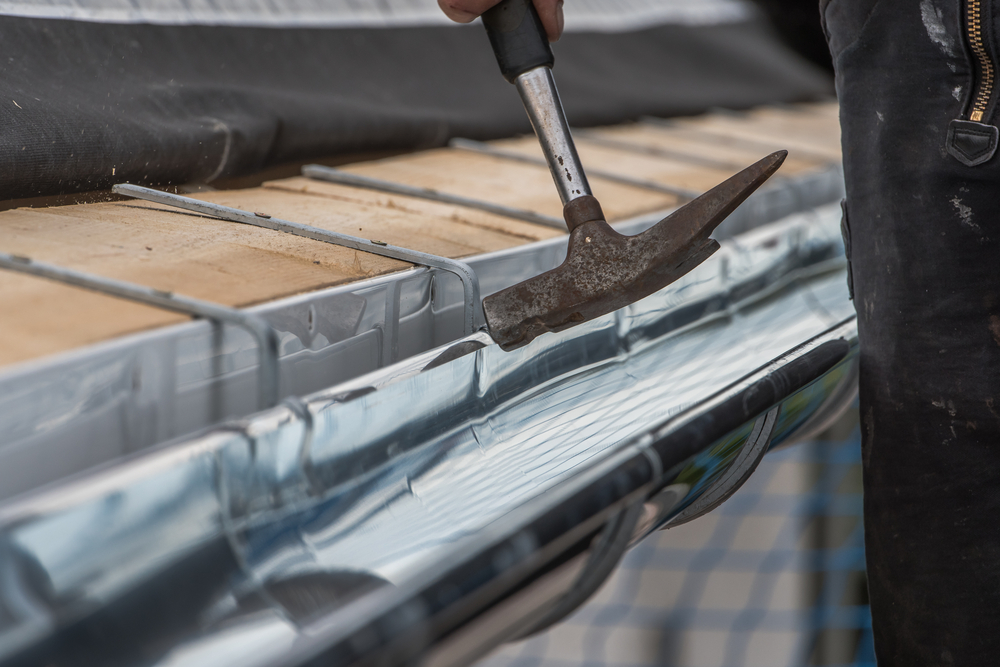Close Up,of,a,newly,installed,gutter,on,a,roof.,craftsmanship