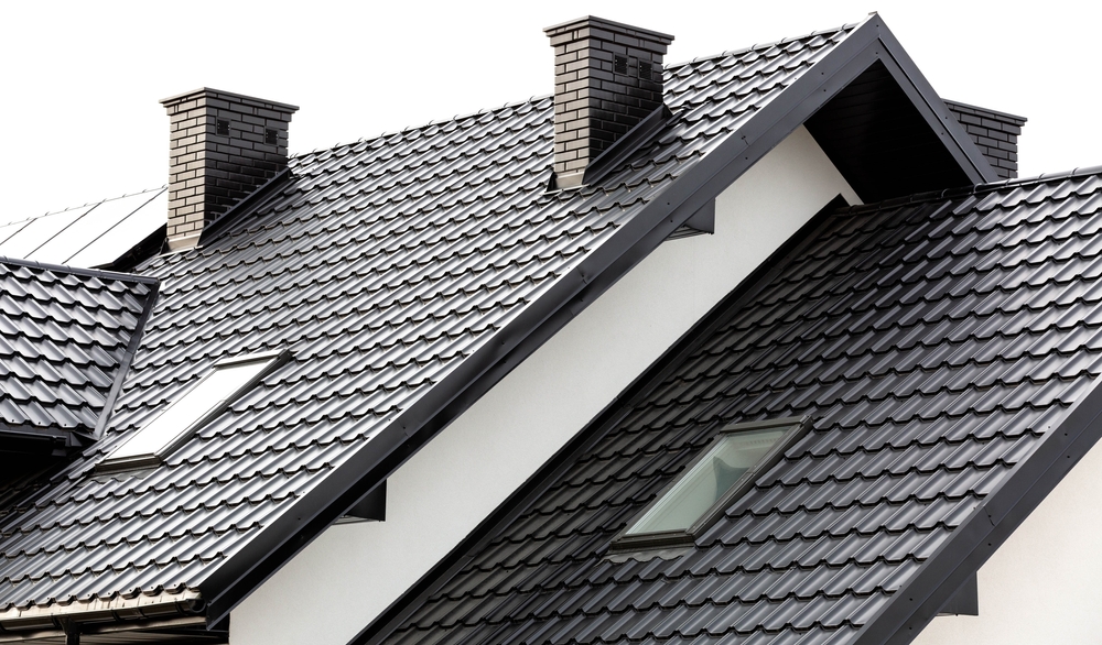 Roof,of,a,new,home.,ceramic,chimney,,metal,roof,tiles,